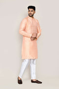 Peach colored jacquard silk kurta paired with straight-fit pants