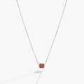 January birthstone necklace featuring a barrel-shaped scarlet crystal in a 14K gold setting