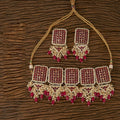 Exquisite golden necklace set featuring white rubies, Kundan pearls, and black Onyx stones