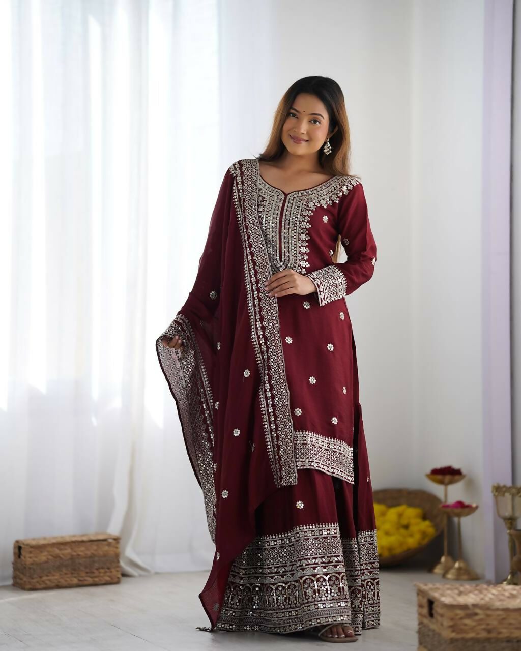 Deep Maroon Silk Kurta Set adorned with exquisite zari, sequins, and thread embroidery.
