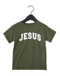 Close up of a festive Jesus themed graphic t-shirt in Christmas colors for children