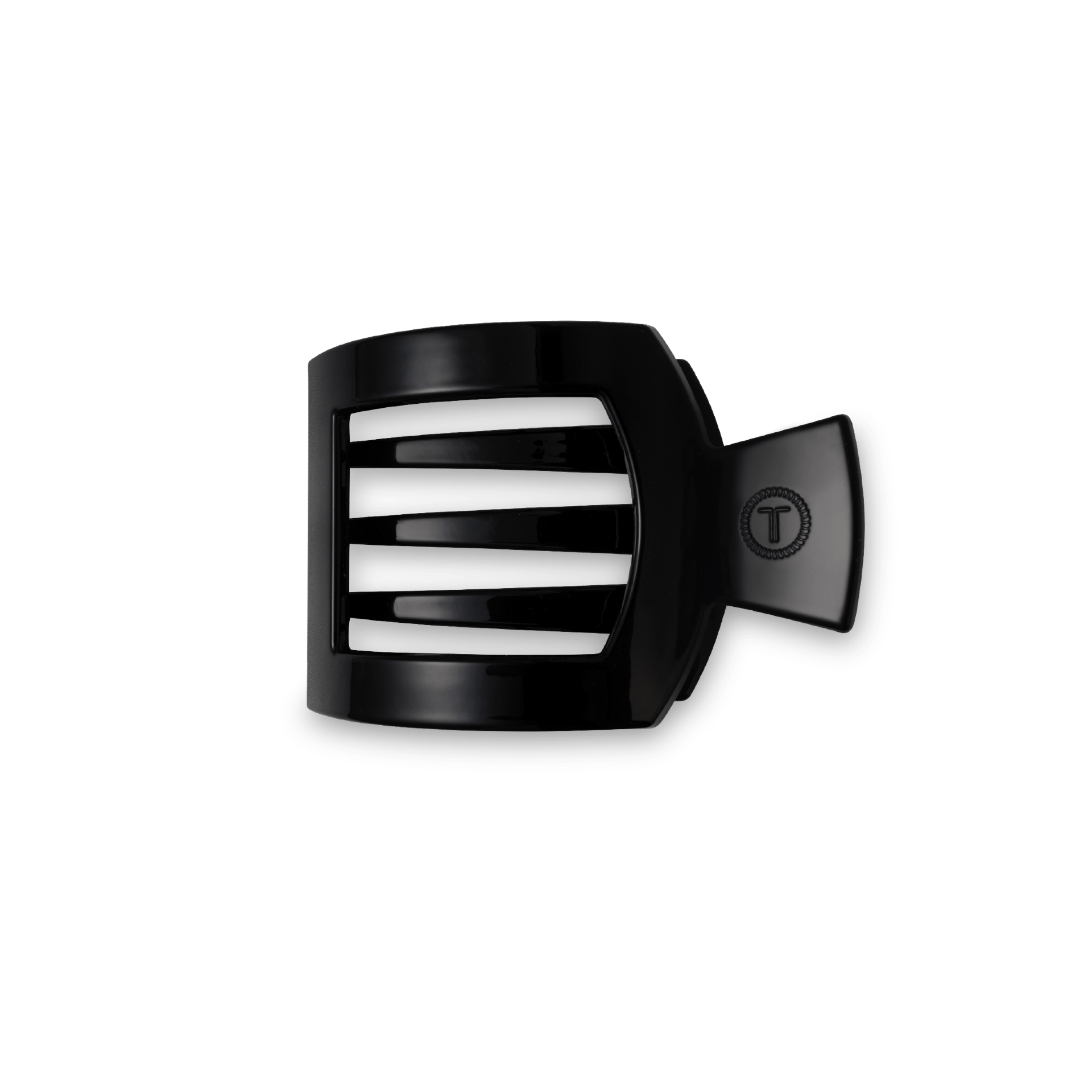 Small square hair clip in black against a clean backdrop