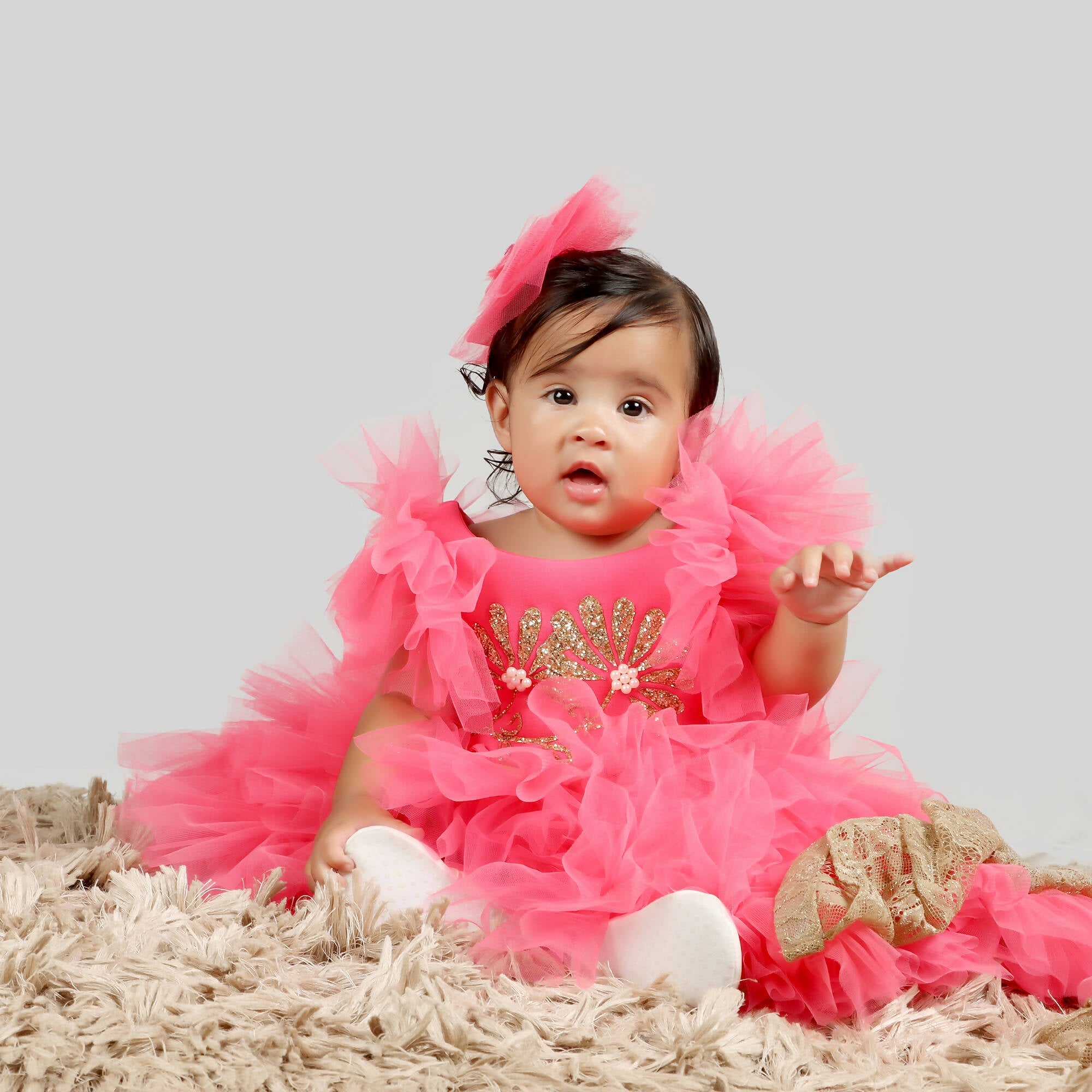 Pink Scuba Bodice Gown with Frill Sleeves and Net Ghera