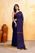 Navy blue cotton blend saree with zari checks and delicate embellishments, draped elegantly