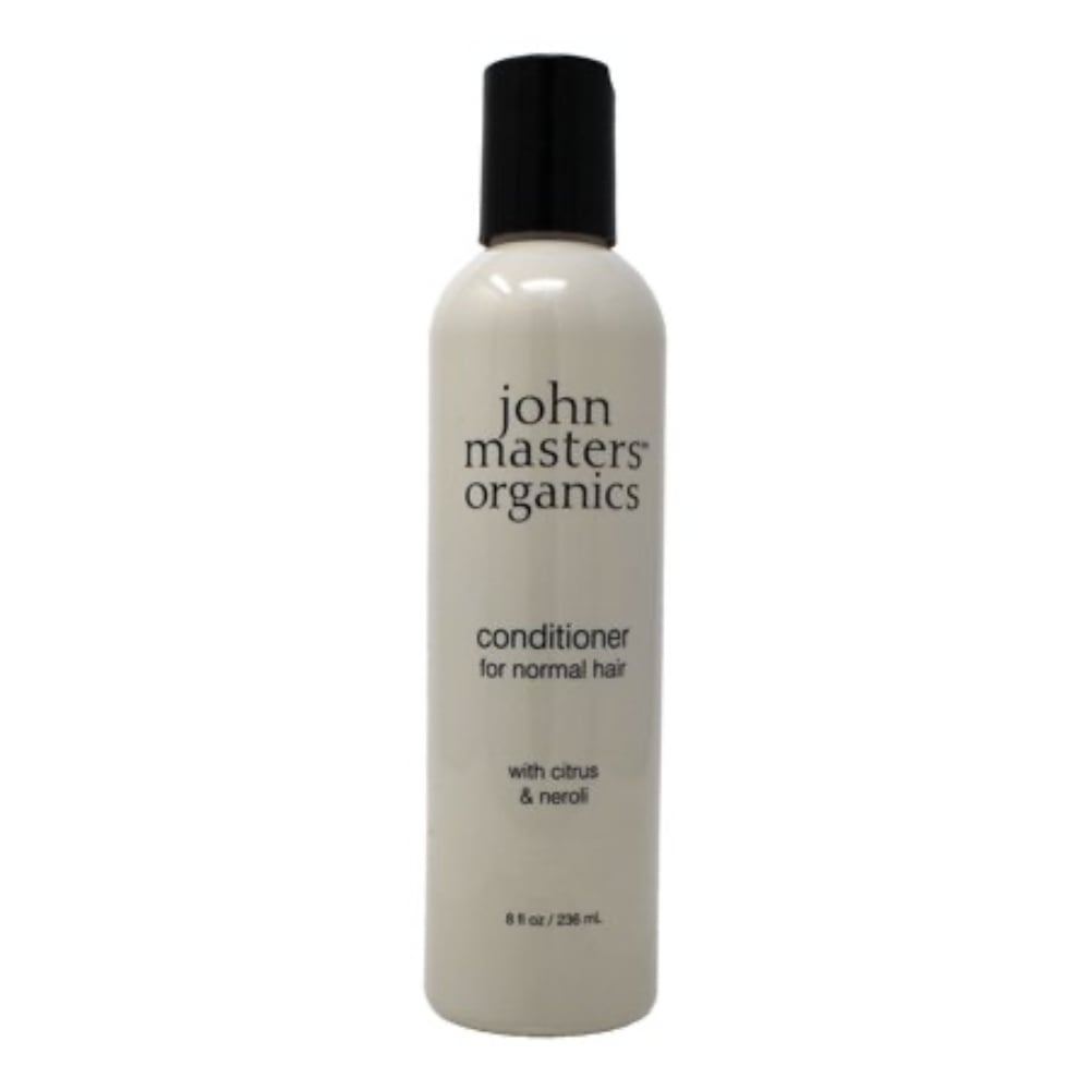 A beige bottle of John Masters Organics Citrus & Neroli conditioner on a neutral background.