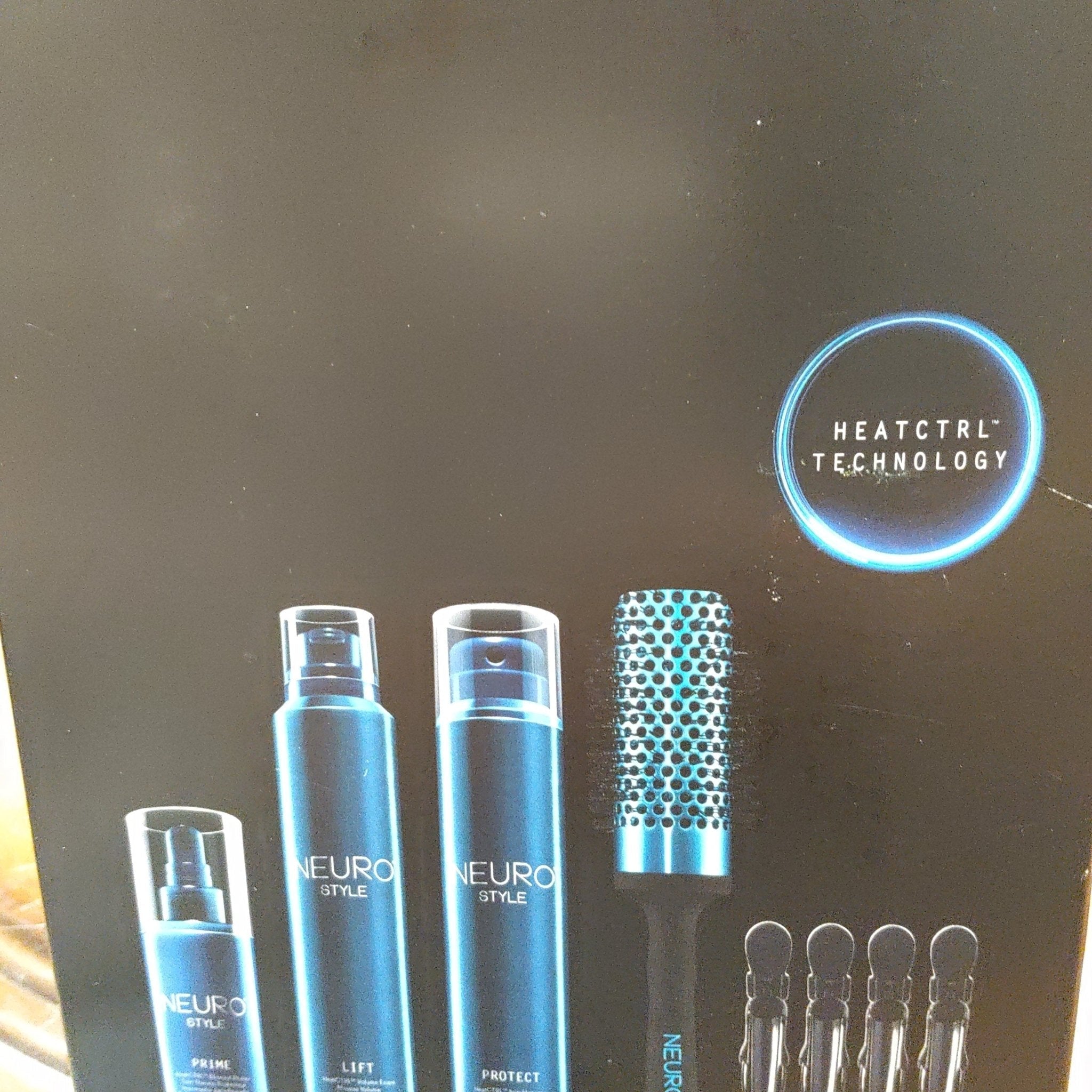 Paul Mitchell Neuro HeatCTRL Stylist Kit Prime and Lift bottles in black and metallic blue.