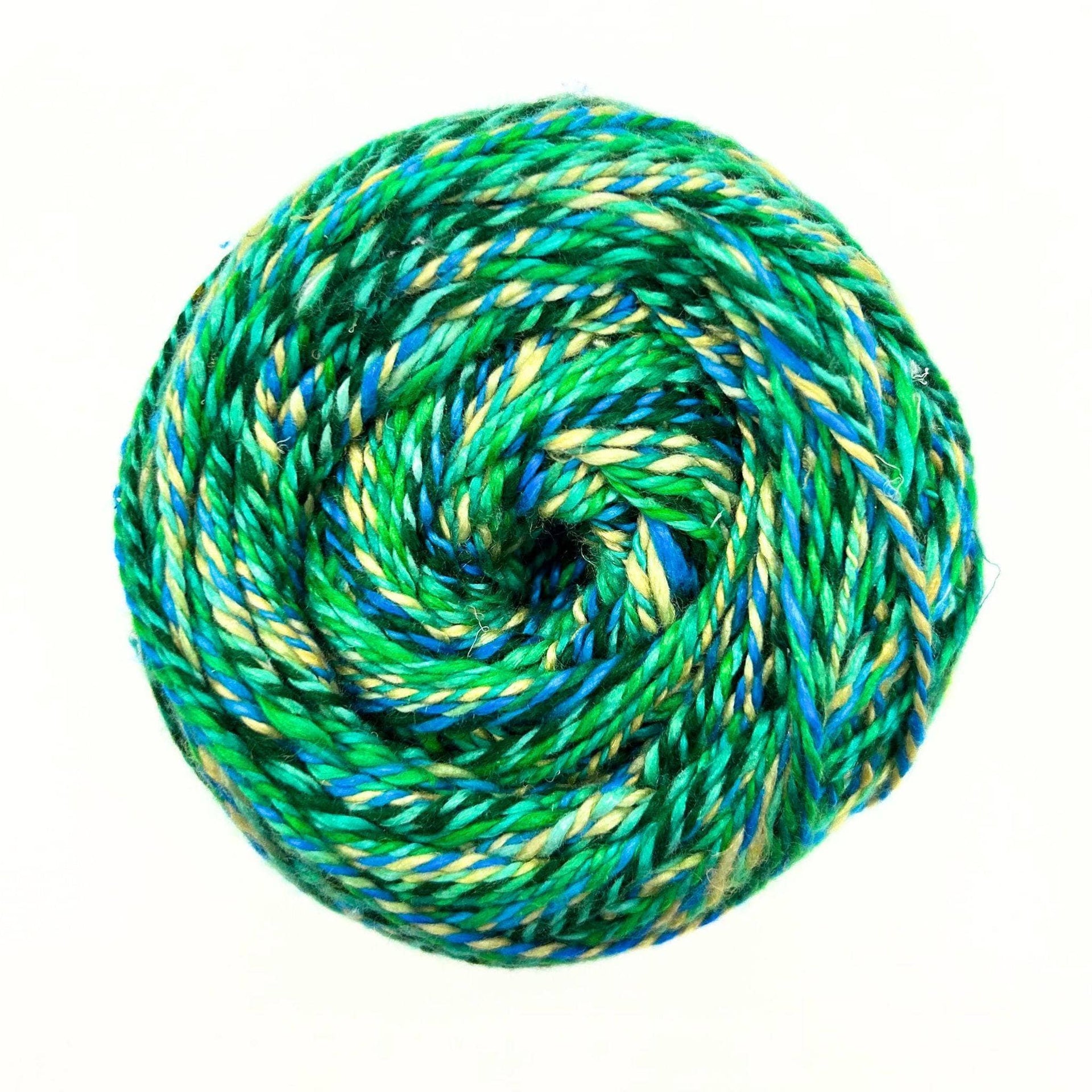 Vibrant collection of Journey Recycled Silk Yarn in green, blue, yellow, pink, orange, and purple