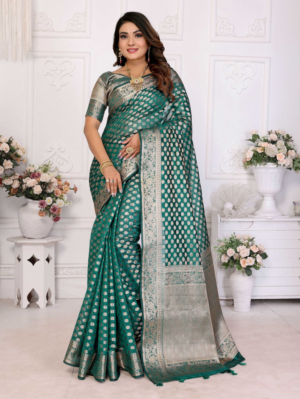 Aastha Fashion green organza silk saree with detailed weaving work and matching blouse piece