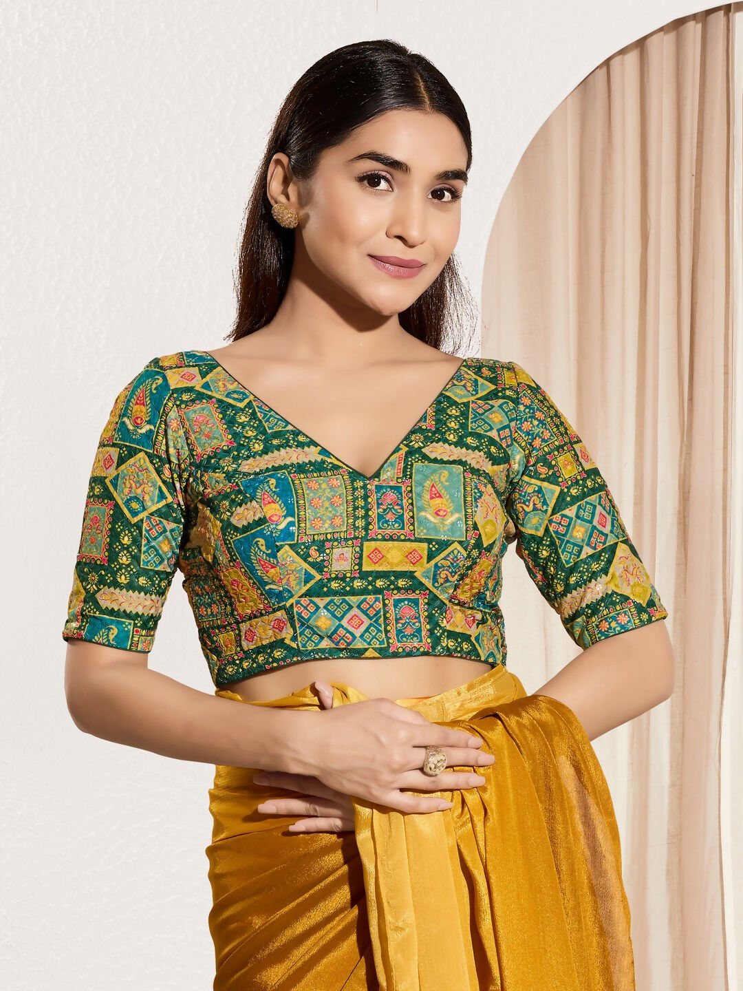 Bottle green viscose rayon blouse with elbow-length sleeves and a V-neck.