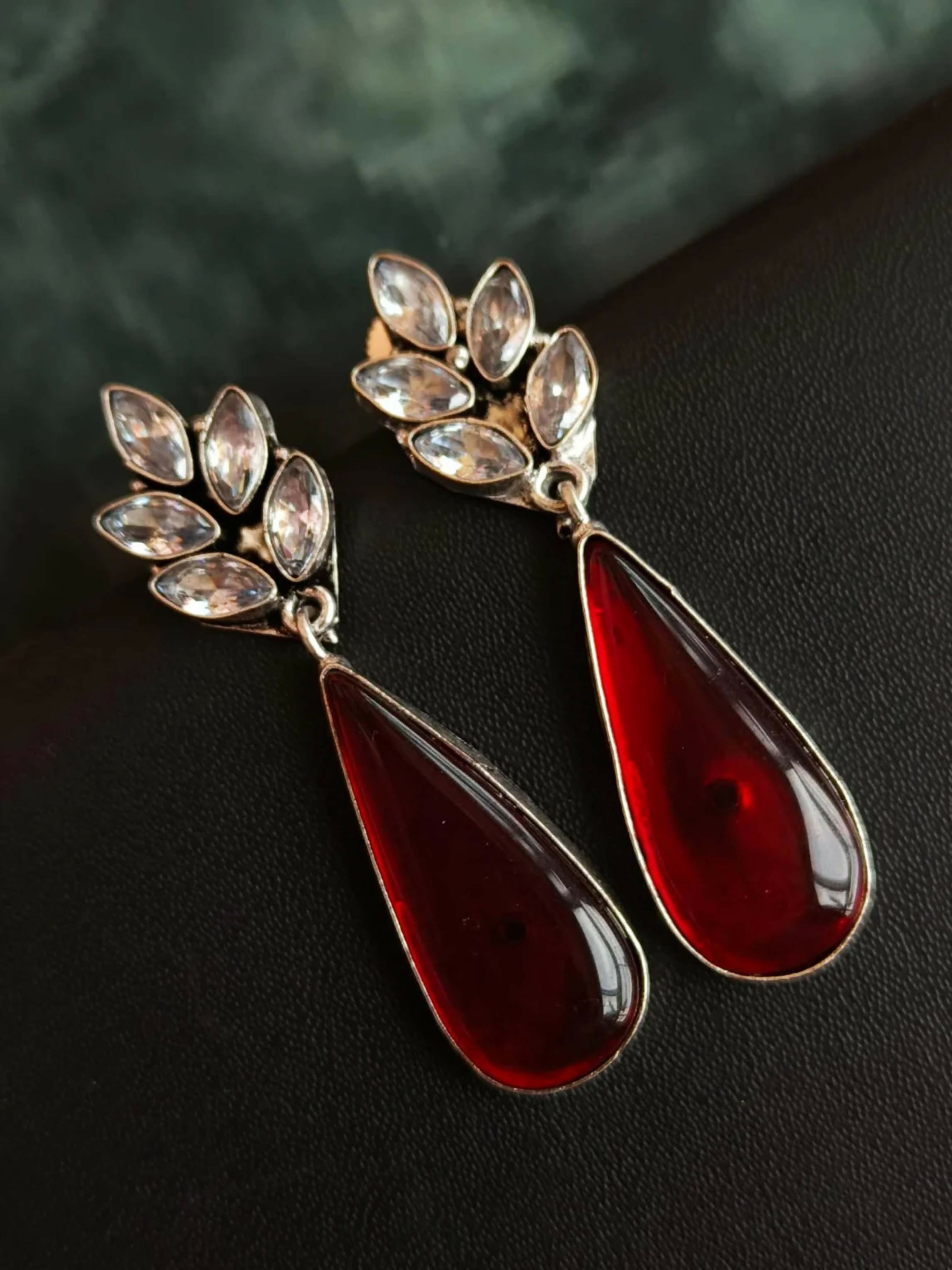 Large red Monalisa stone partywear earrings in oxidized brass