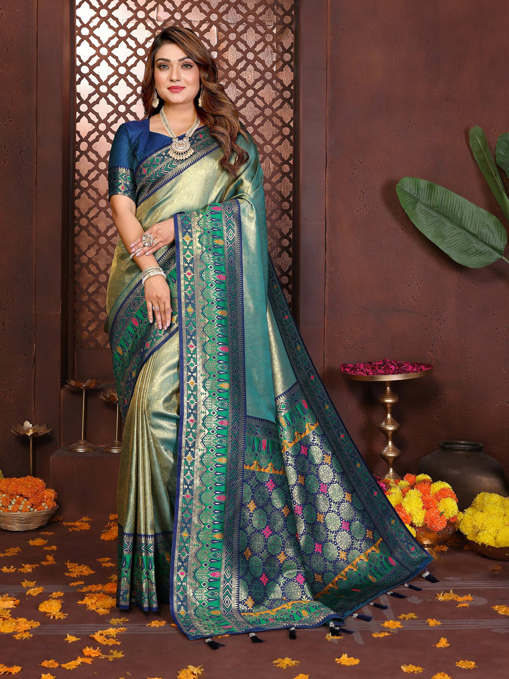 Sea green tissue silk saree with woven details and metallic sheen