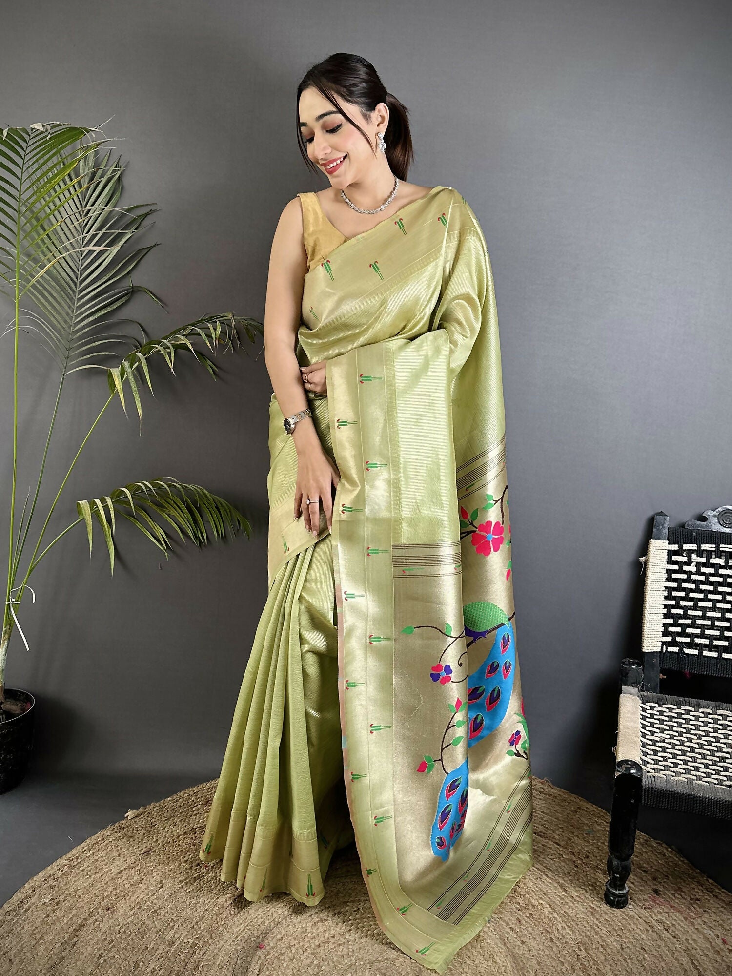 Pista Green tissue Paithani saree with peacock and floral motifs and matching unstitched blouse