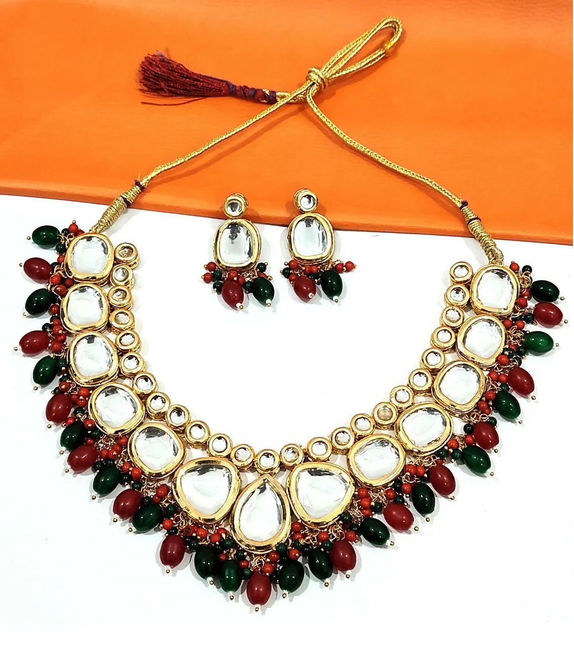 Close up of artisan Kundan stone studded gold plated jewellery set