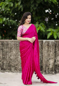 Rani silk blend saree with woven butterfly pattern and cotton tassels on pallu