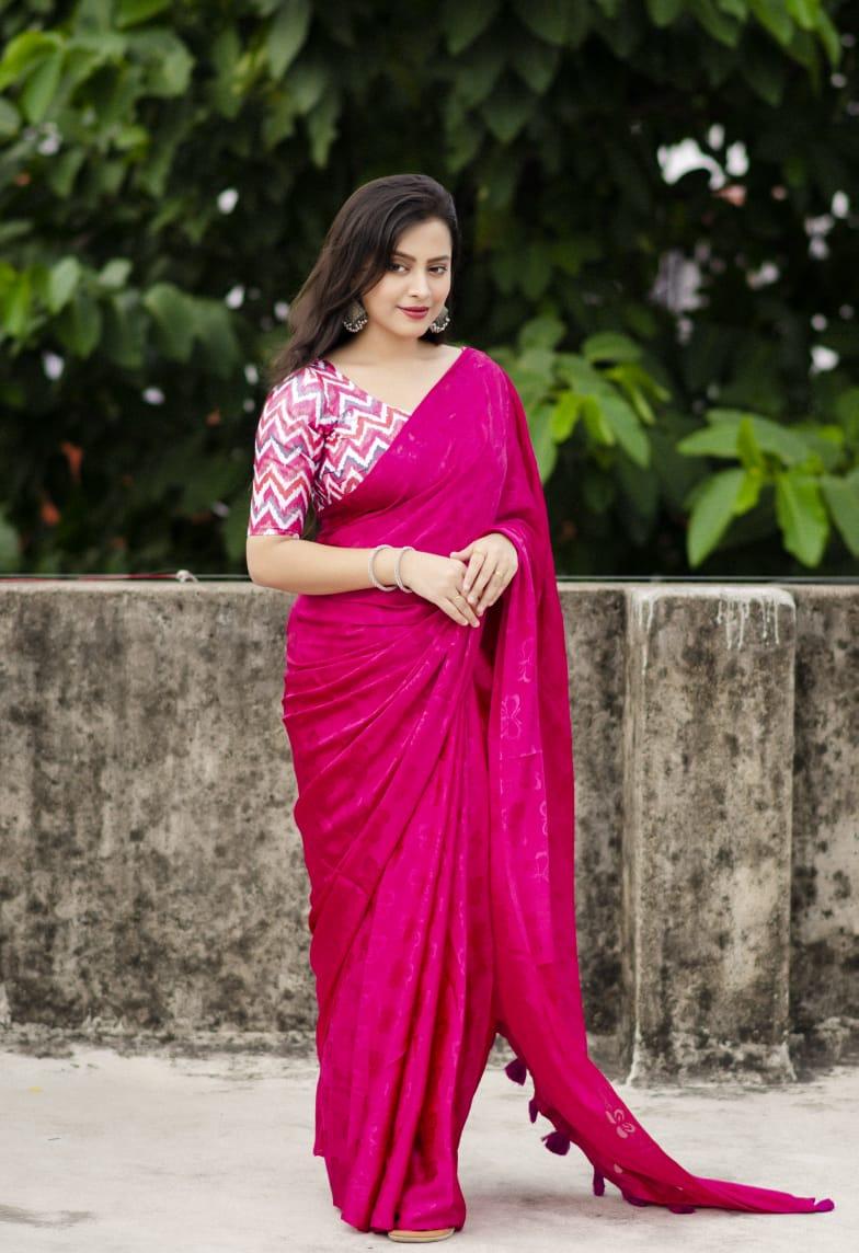 Rani silk blend saree with woven butterfly pattern and cotton tassels on pallu