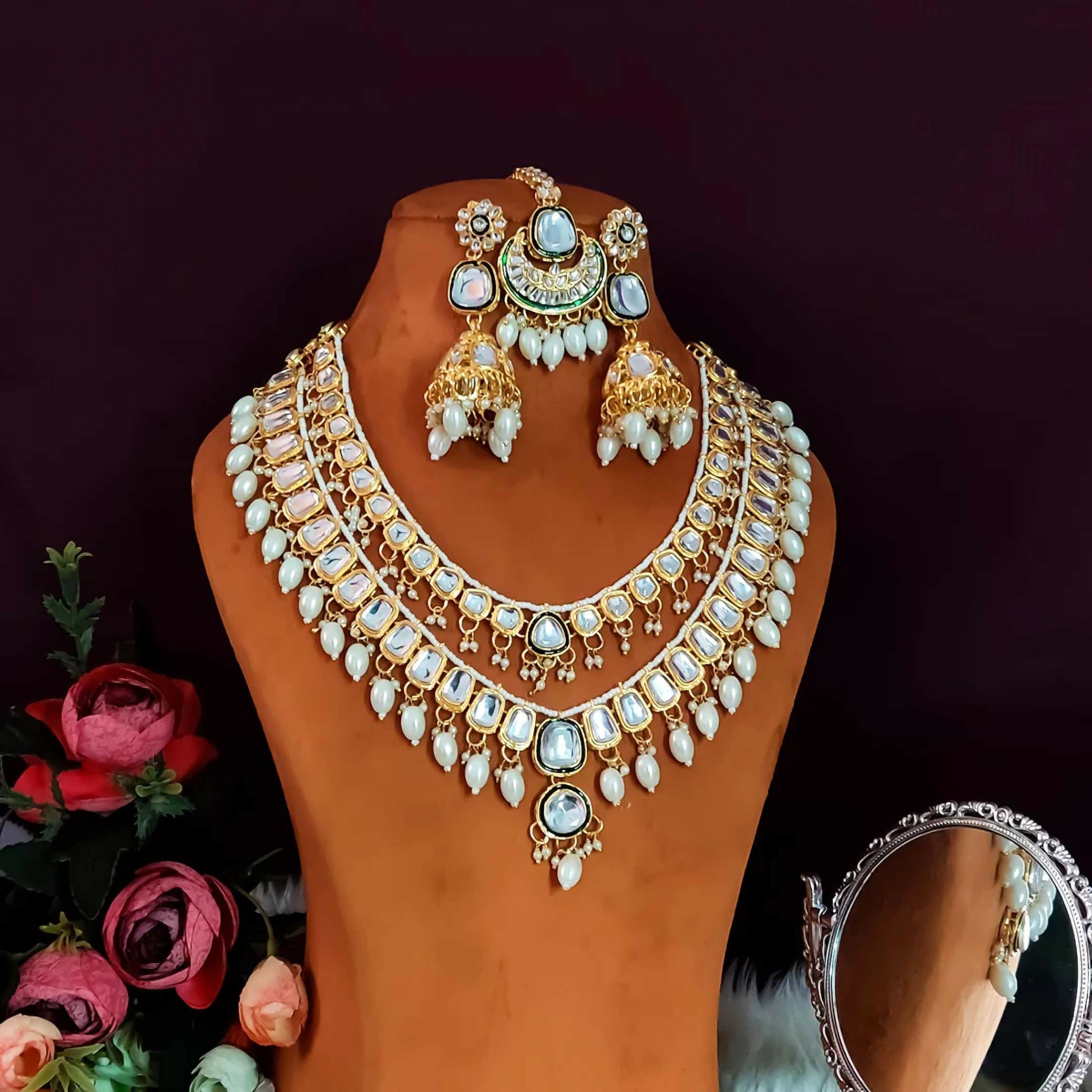 Deep double layer Kundan necklace set in green and white with brass base, elegant ethnic design