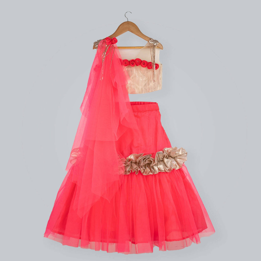 Pink Cow Fashions golden choli with sequin embellishments and pink raw silk ghagra with frill detailing