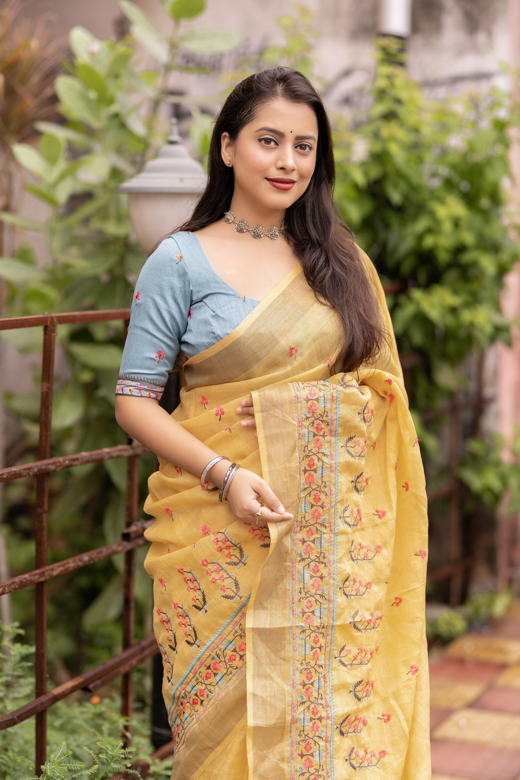 Yellow Pure Linen Saree with Ethnic Motifs and Embroidered Blouse