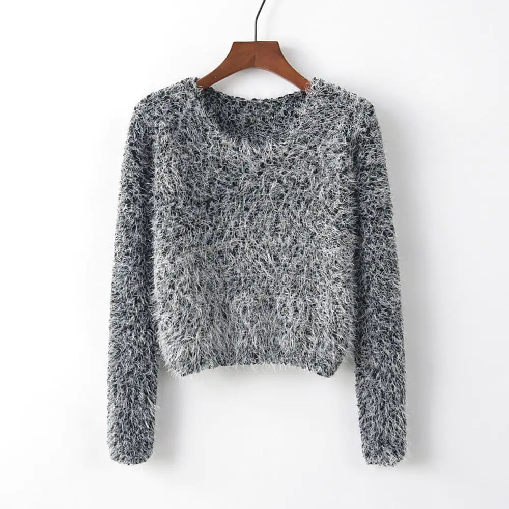 A soft fuzzy long-sleeve round neck pullover sweater shown in white and a black-and-white mixed knit