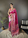 Pink Banarasi saree featuring elephant and floral motifs with a contrasting green blouse