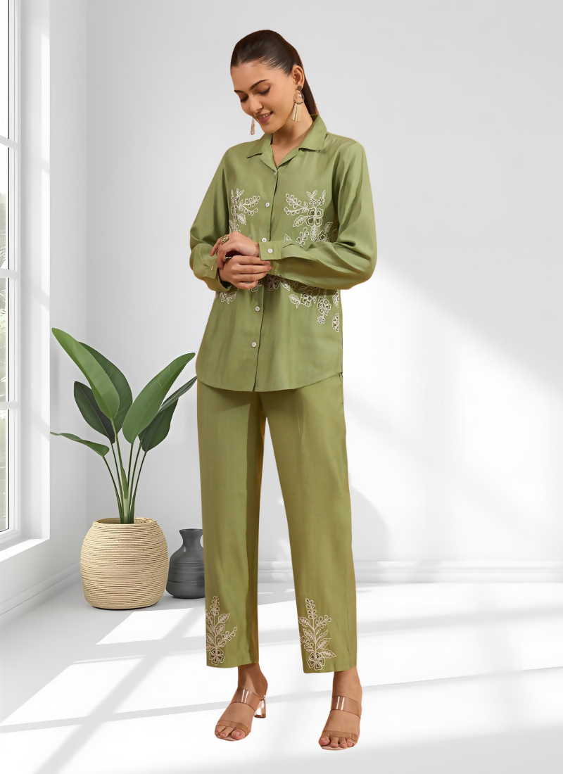 Green silk readymade cord set with intricate embroidery and collared top