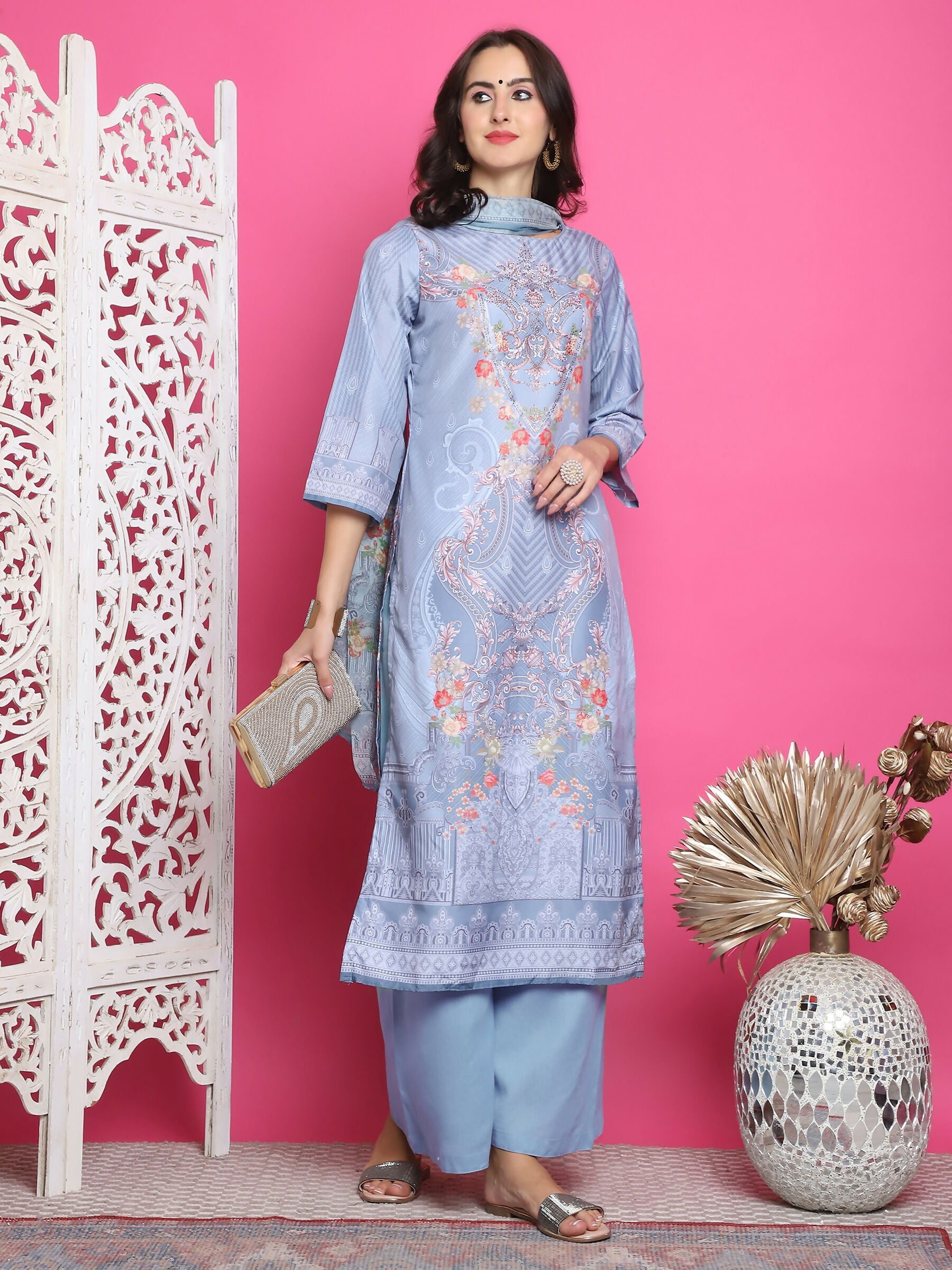 Elegant grey satin kurta featuring digital floral prints and crystal embellishments, includes matching trousers and a dupatta.