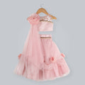 Old rose colored ghagra choli with sequence flower embellishments and pearl drop borders.