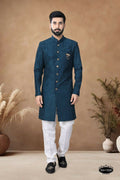 Men wearing a blue silk Indo-Western kurta with heavy thread and sequence embroidery details.