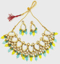 Close-up view of gold-plated Kundan necklace with stone detailing