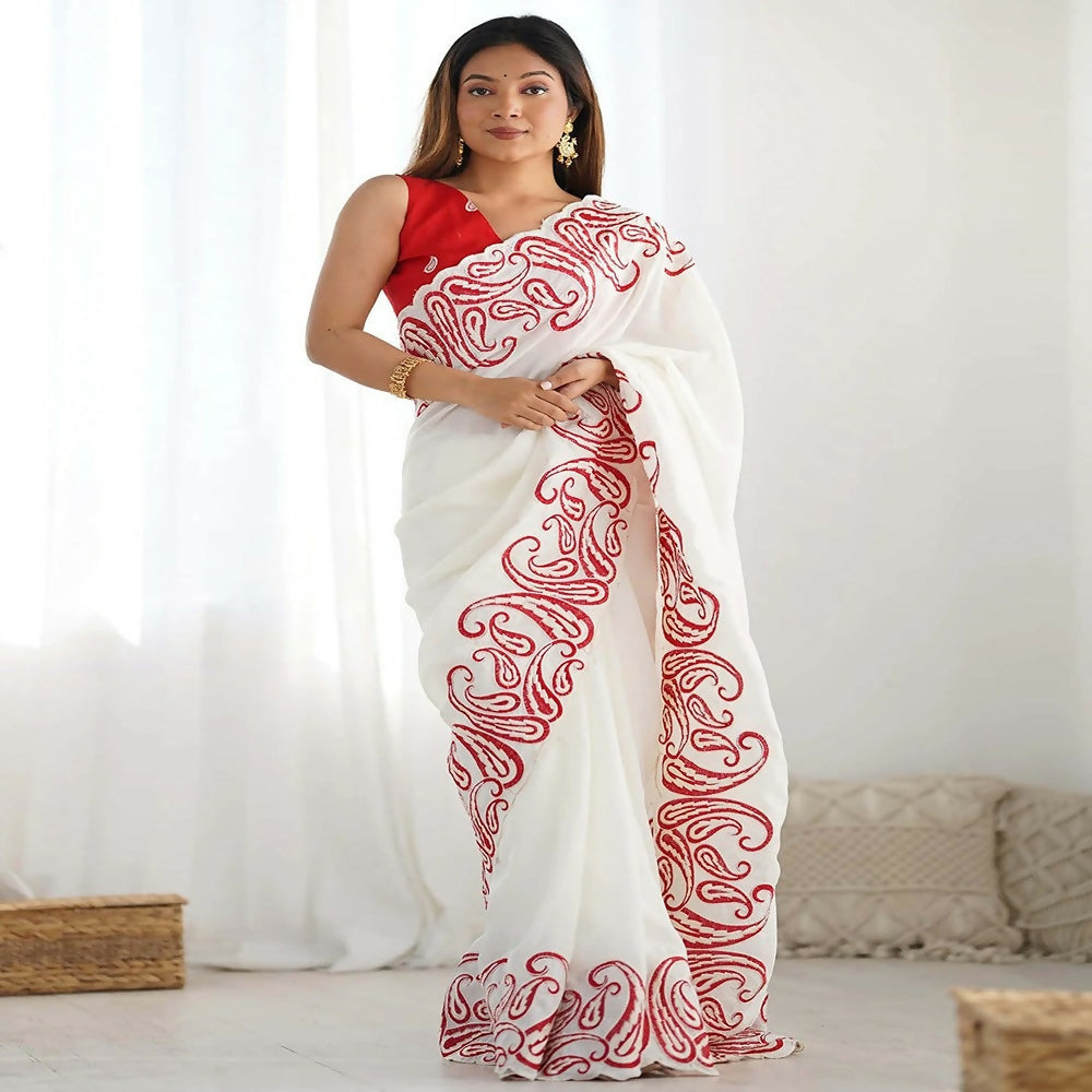 Off white and red silk blend saree with ornate embroidered scalloped border