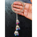 Classic silver-tone bangle embellished with traditional hanging jhumka charms.
