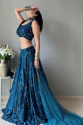 A blue faux georgette lehenga choli with intricate thread embroidery and sequin work.