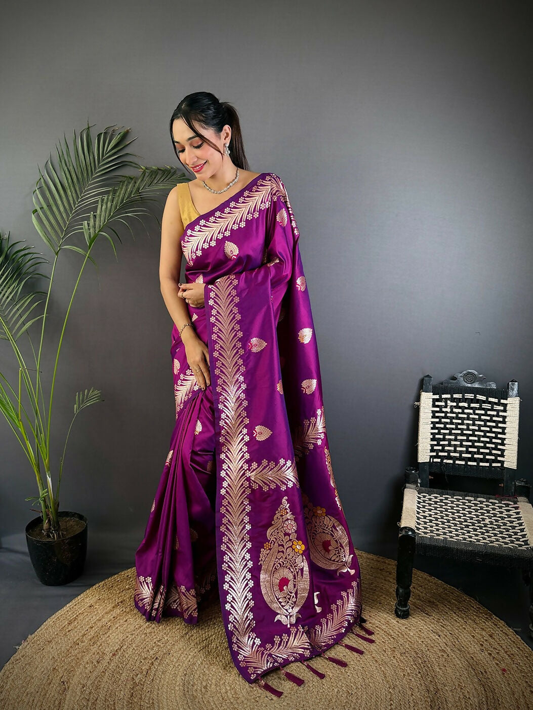 Rich purple Banarasi soft silk saree with detailed woven patterns and matching blouse