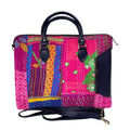 Vibrant Kantha patchwork laptop bag in fuchsia and navy-blue with faux leather handles.