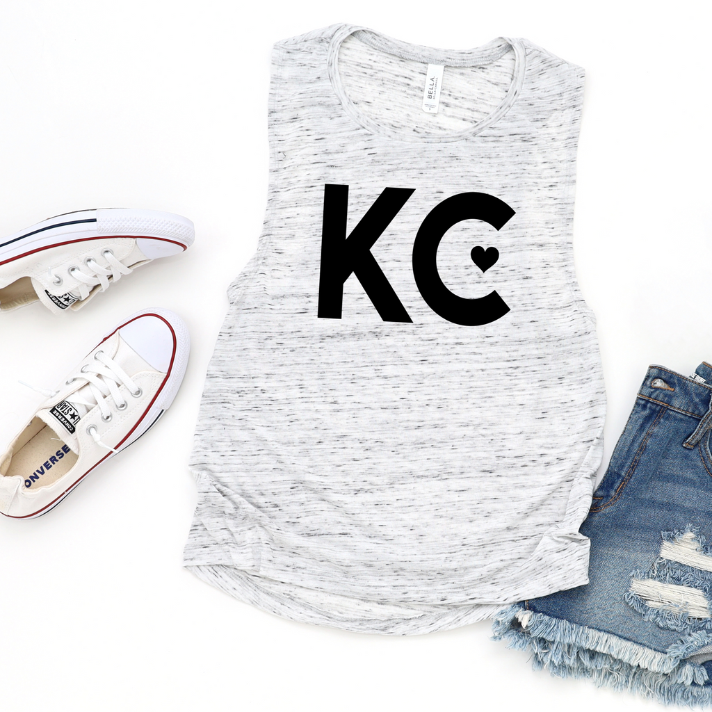 White marble muscle tank top with black KC heart graphic flat lay