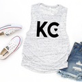 White marble muscle tank top with black KC heart graphic flat lay