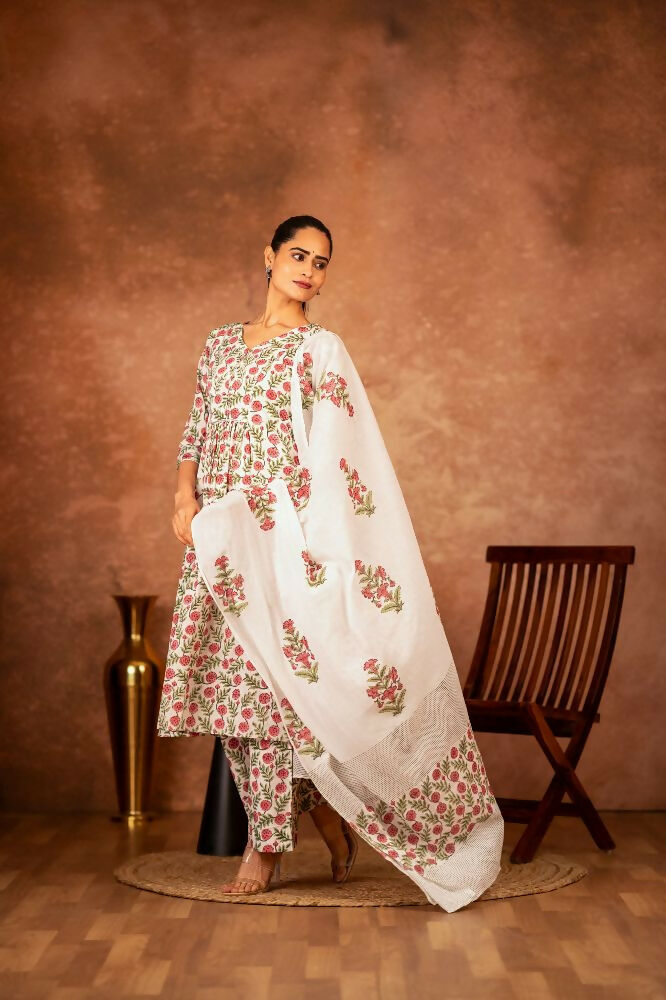 Detailed view of the red and green block printed cotton fabric