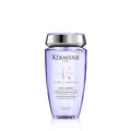 Kérastase Blond Absolu Bain Lumiere shampoo in a translucent purple bottle with a silver cap