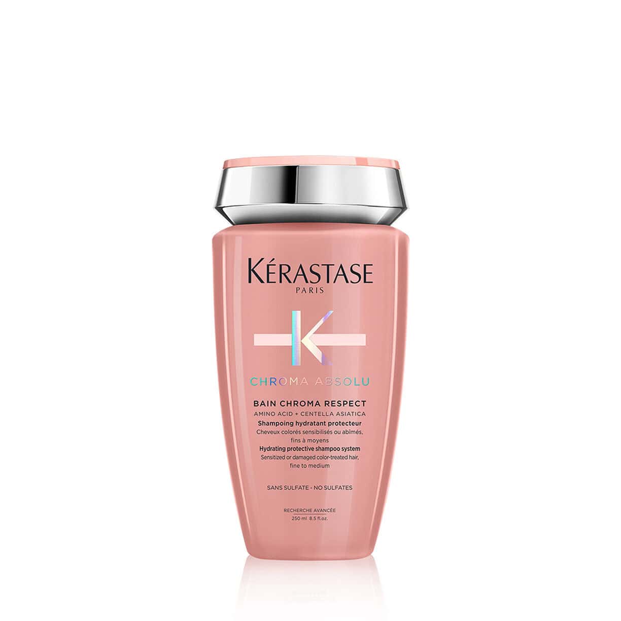 Bottle of Kérastase Bain Chroma Respect sulfate-free shampoo in pink and silver bottle.