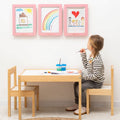 Minimalist A4 kids art display frame in light wood and pink finishes for gallery wall