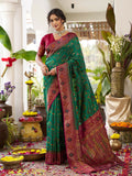 Green soft silk saree with a contrast maroon blouse piece