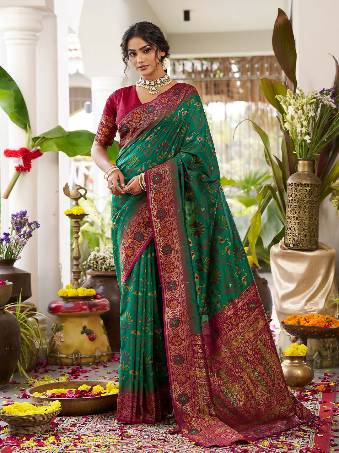 Green soft silk saree with a contrast maroon blouse piece