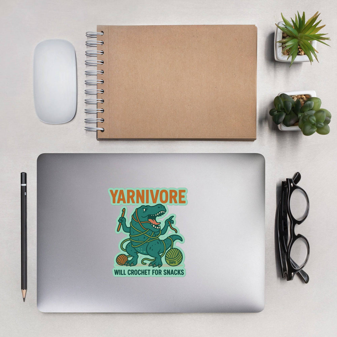 Dinosaur sticker featuring a T-Rex tangled in yarn with the text 'Will Crochet for Snacks'