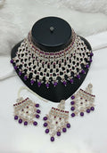 Purple stone and pearl work necklace set with traditional earrings and tikka