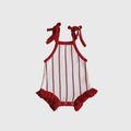 Baby wearing a red and white pinstripe knit romper with ruffles and snap closures