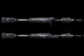 Close up of two Kovert Series casting fishing rod handles with textured grips on a black background.