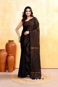 Black cotton blend handloom saree with zari check embellishments and elegant drape.