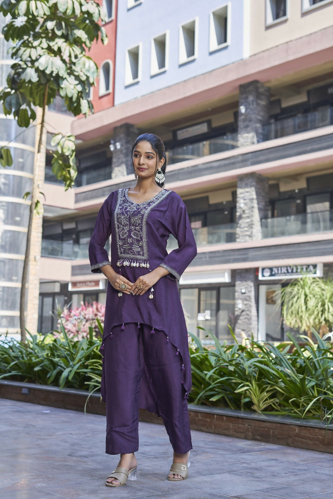 Close up of a purple printed Dola silk kurta set featuring artisanal handwork and a modern cut.