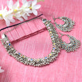 Oxidised silver-plated brass choker set with vibrant Meena work