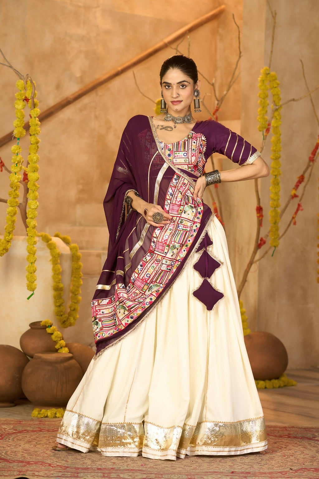 Off white crepe lehenga with wine blouse and dupatta for Navratri
